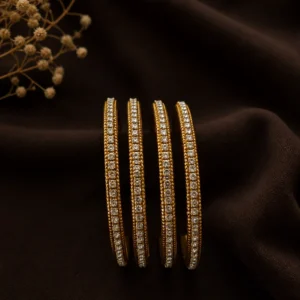 Beautiful Golden metal bangles with stones 2.4inches set of 4