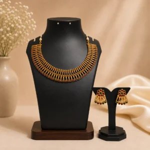 Choker-style necklace with matching Jhumka earrings.